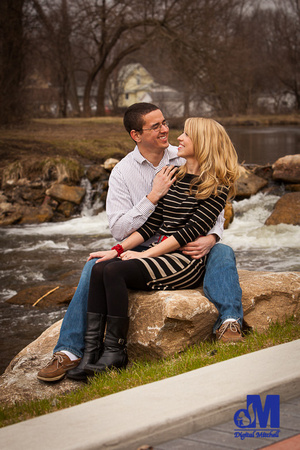 Photograph of engaged couple on rocks
