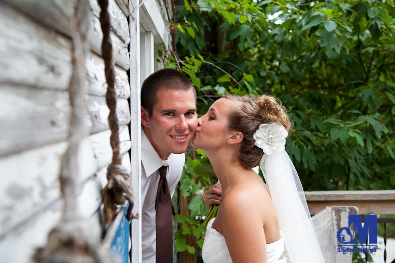 photographing a wedding kiss