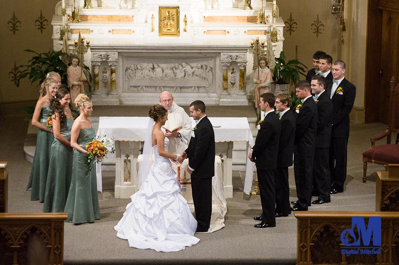 photographing the bride and groom at the alter