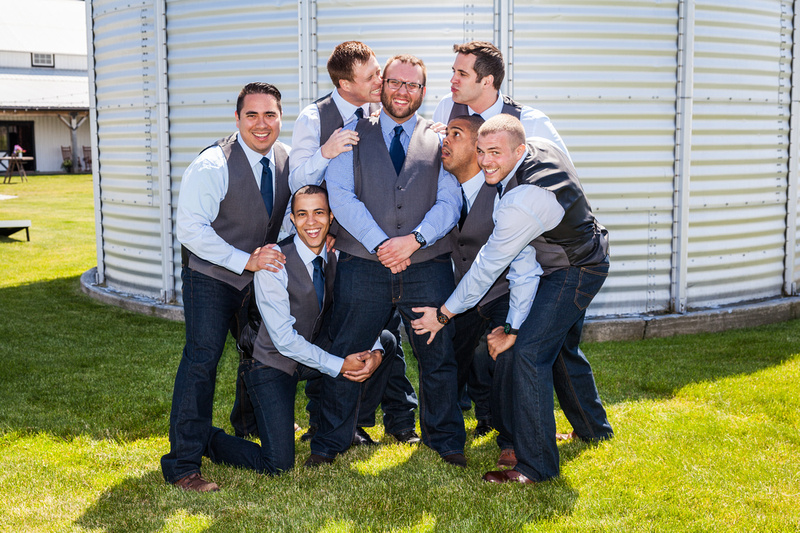groomsmen holding onto groom